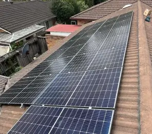 Roof with newly installed solar panels, showing a clean and professional setup.